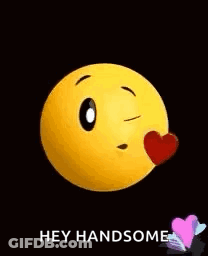 Yellow Smiley Holding Heart Says Hey Handsome GIF