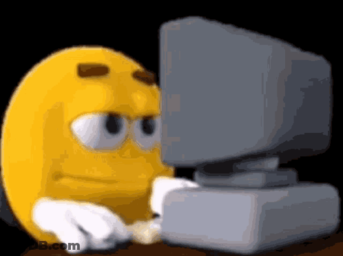 Yellow Smiley Looking At Computer Monitor GIF