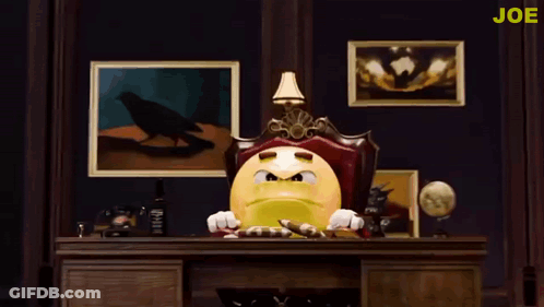 Yellow Smiley Sitting At Desk Saying Joe GIF