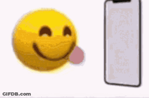 Yellow Smiley With Blue Hat Looking At Cellphone GIF