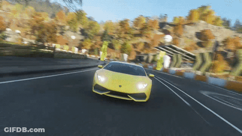 Yellow Sports Car Driving Down Road GIF
