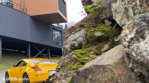 Yellow Sports Car Parked In Front Of Building GIF