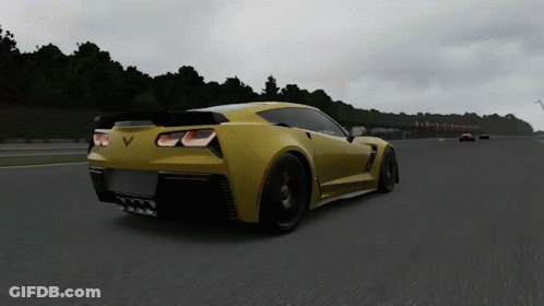Yellow Sports Car With Letter V Driving Down Road GIF