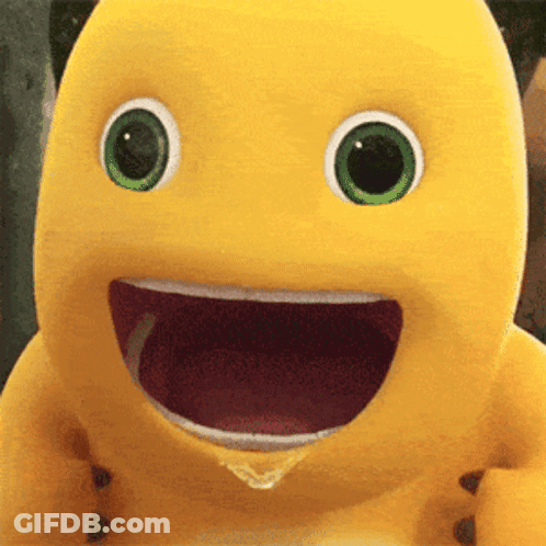Yellow Stuffed Animal With Green Eyes Smiling With Mouth Open GIF
