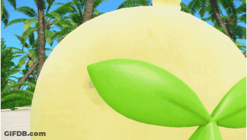 Yellow Stuffed Animal With Red Tongue On Sandy Beach GIF