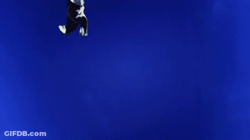 Yellow Teddy Bear On Grass Hill GIF