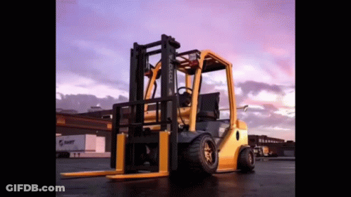 Yellow Toyota Forklift Parked At Sunset GIF