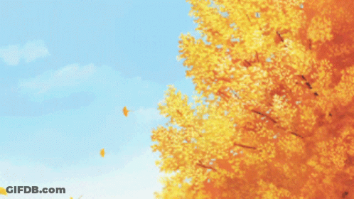 Yellow Tree With Blue Sky And Falling Leaf GIF