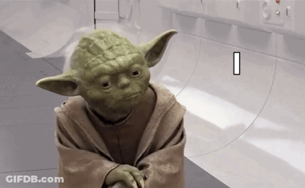 Yoda From Star Wars Is Standing In A Room With A White Wall . GIF
