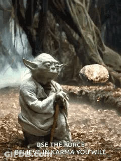 Yoda Holding Cane And Rock GIF