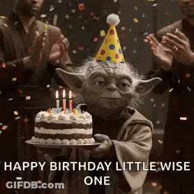 Yoda Is Holding A Birthday Cake With Candles And A Party Hat . GIF