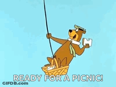 Yogi Bear Flying In Hot Air Balloon Holding Paper GIF