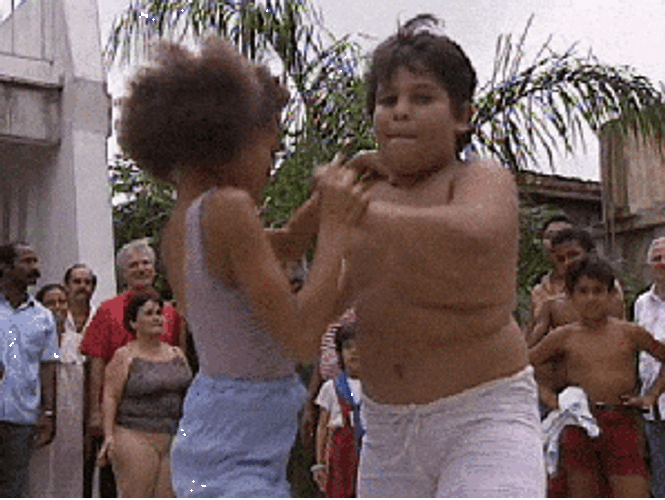 Young Boy And Girl Performing Salsa GIF