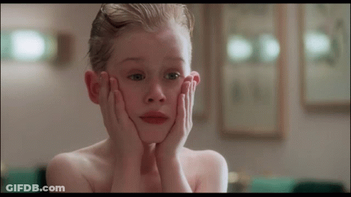Young Boy Covering Face GIF
