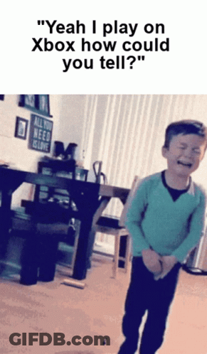 Young Boy Crying In Front Of All You Need Is Love Sign GIF