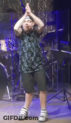 Young Boy Dancing In Front Of Drum Kit GIF