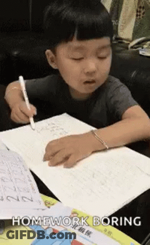 Young Boy Doing Homework At Table GIF