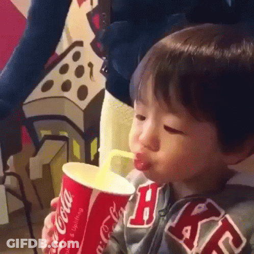 Young Boy Drinking From Coca-Cola Cup GIF