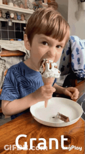 Young Boy Eating Ice Cream Cone With Grant GIF
