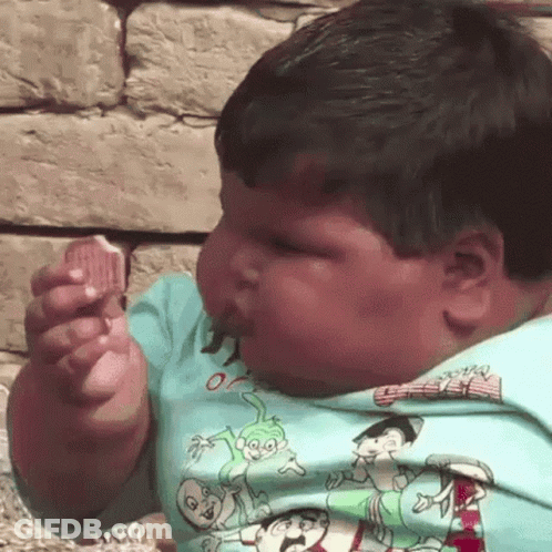 Young Boy Eating Ice Cream GIF