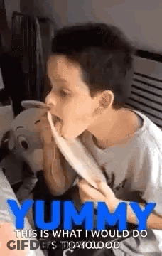 Young Boy Eating With Tongue Out GIF