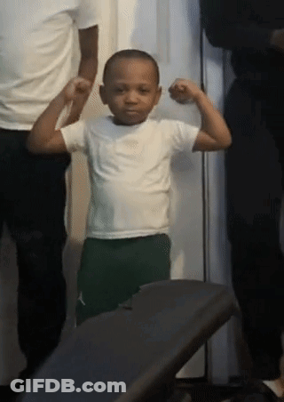 Young Boy Flexing Muscles Next To Man And Woman GIF