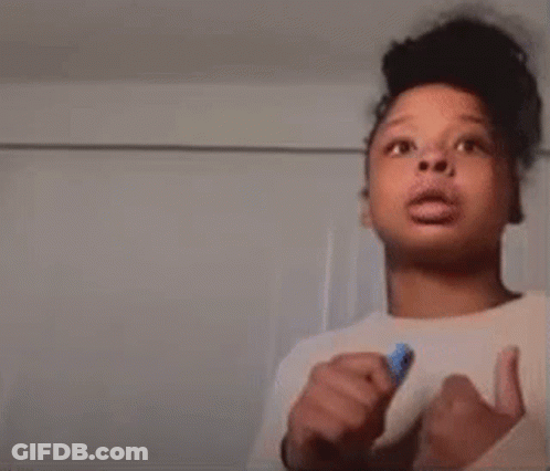 Young Boy Giving Thumbs Up Holding Blue Marker GIF