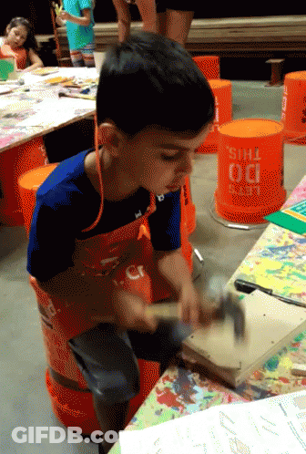 Young Boy Hammering Wood In Front Of Do This Bucket GIF