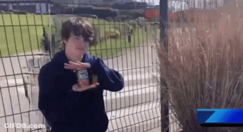 Young Boy Holding Can Of Big Mac GIF