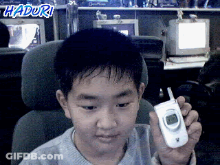Young Boy Holding Cell Phone With Haduri GIF