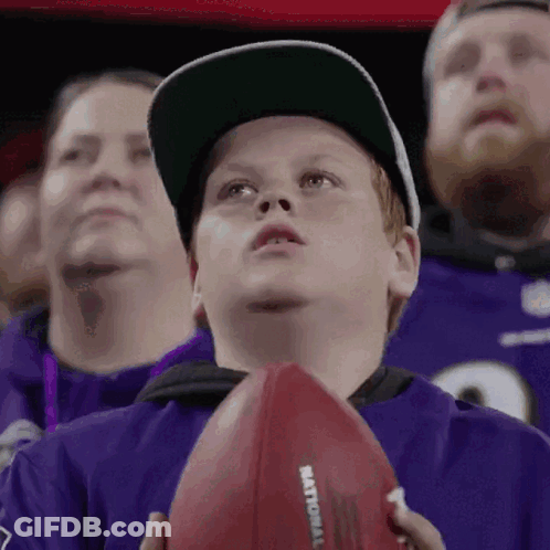 Young Boy Holding Football Saying National GIF