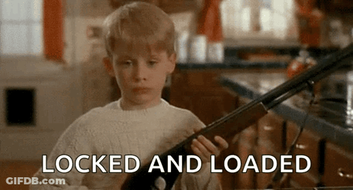 Young Boy Holding Shotgun Saying Locked And Loaded GIF