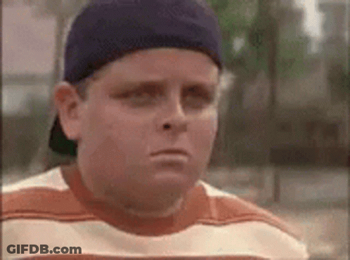 Young Boy In Baseball Cap Making Funny Face GIF