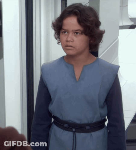 Young Boy In Blue Shirt And Black Belt GIF
