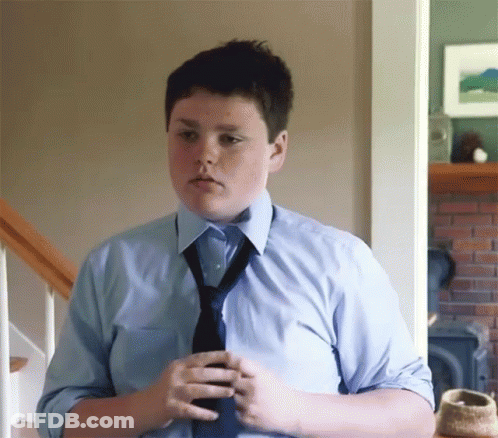Young Boy In Blue Shirt And Tie GIF