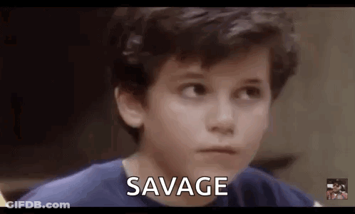 Young Boy In Blue Shirt Making Funny Face Saying Savage GIF