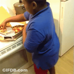 Young Boy In Blue Shirt Reaching For Pizza GIF