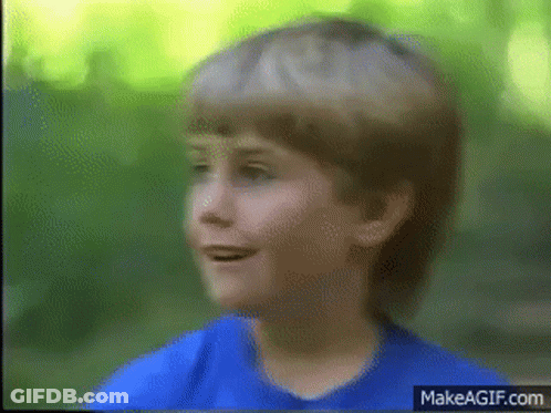 Young Boy In Blue Shirt Smiling GIF