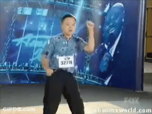 Young Boy In Blue Shirt With Number 32716 GIF