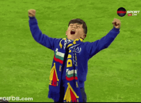 Young Boy In Blue Sweatshirt With Du Scarf GIF