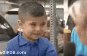 Young Boy In Blue Talking To Woman GIF