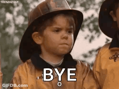 Young Boy In Fireman Hat Saying Bye Next To Another Boy GIF