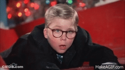 Young Boy In Glasses And Black Coat Lying On Ground GIF