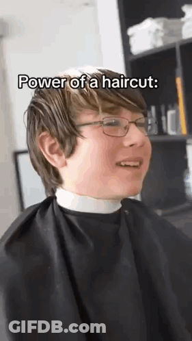 Young Boy In Glasses And Cape Getting Haircut GIF