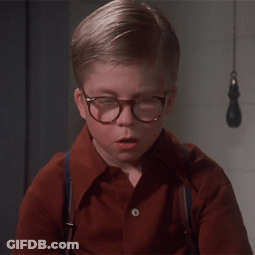 Young Boy In Glasses And Suspenders Looking Down GIF