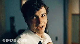 Young Boy In Glasses And Tie Looking At Camera GIF