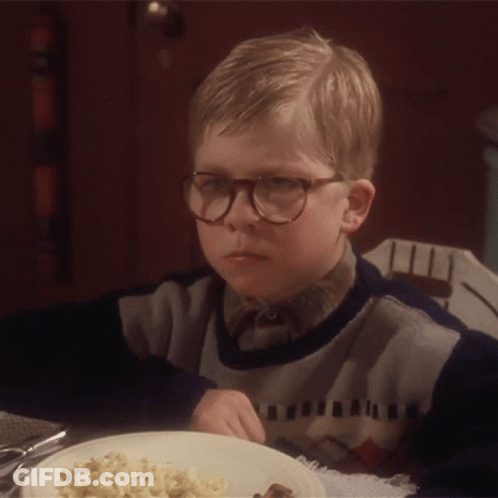 Young Boy In Glasses At Table With Food GIF