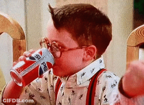 Young Boy In Glasses Drinking Pepsi Can GIF