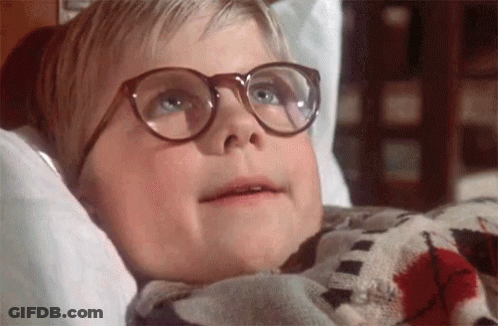 Young Boy In Glasses Lying In Bed With Blanket GIF