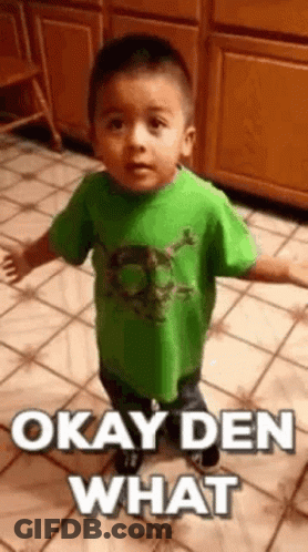 Young Boy In Green Shirt Making Funny Face GIF